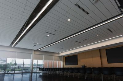 Event hall with roller shades along the window wall