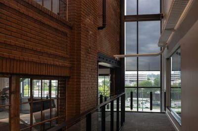 Brick wall and tall steel windows in the crane room