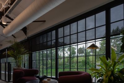 Lounge with full-height steel windows